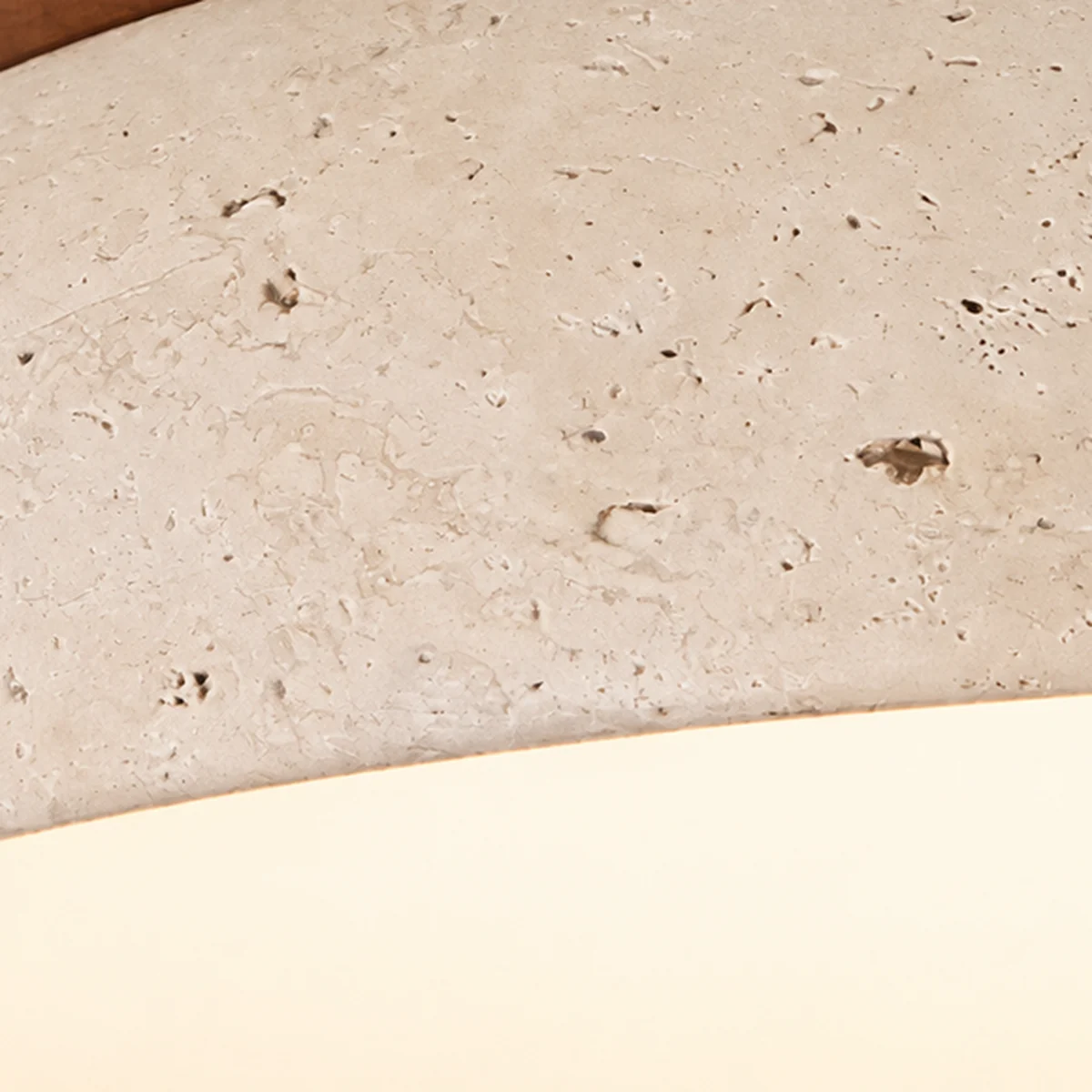 Close view of natural travertine pores on the Dominic shade