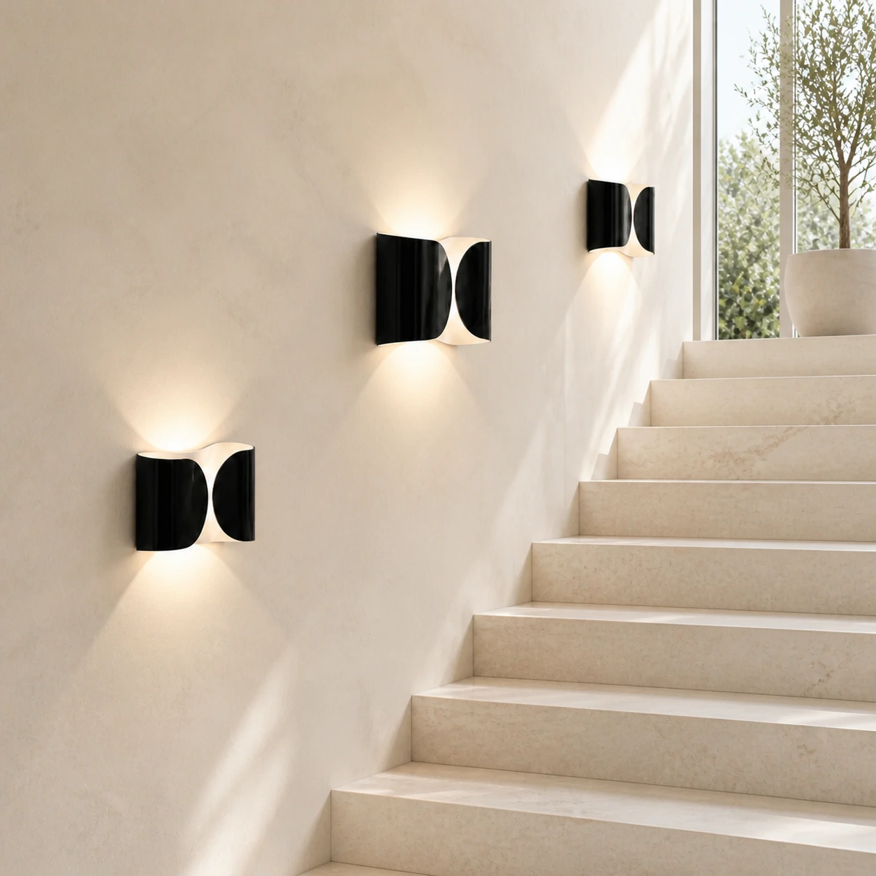 Three Black Foglio Wall Lamps arranged along one stair wall