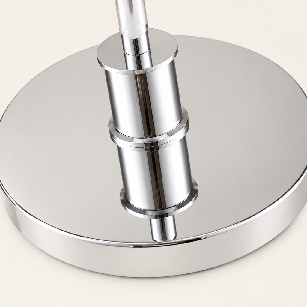 Close view of the Chiron polished metal base and cylindrical collar