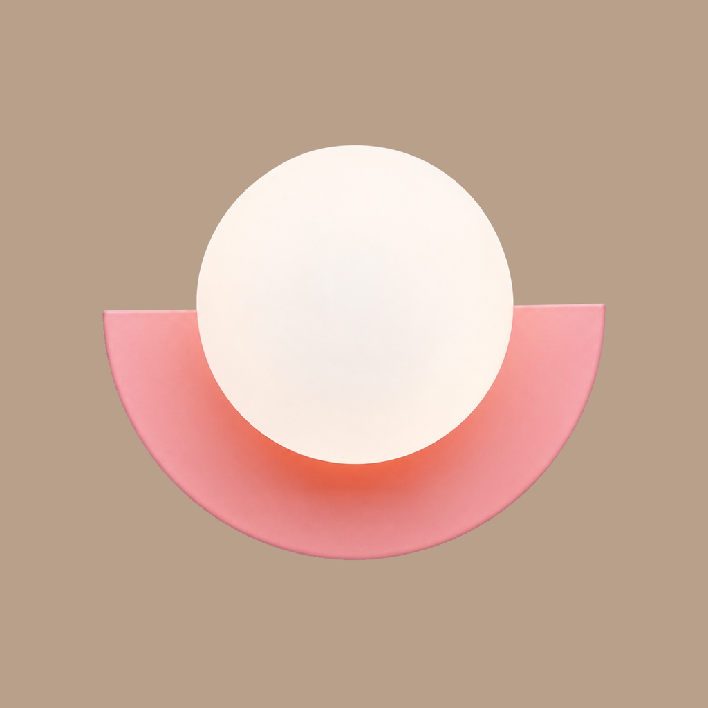 Pink Macaron orb wall lamp on light brown background