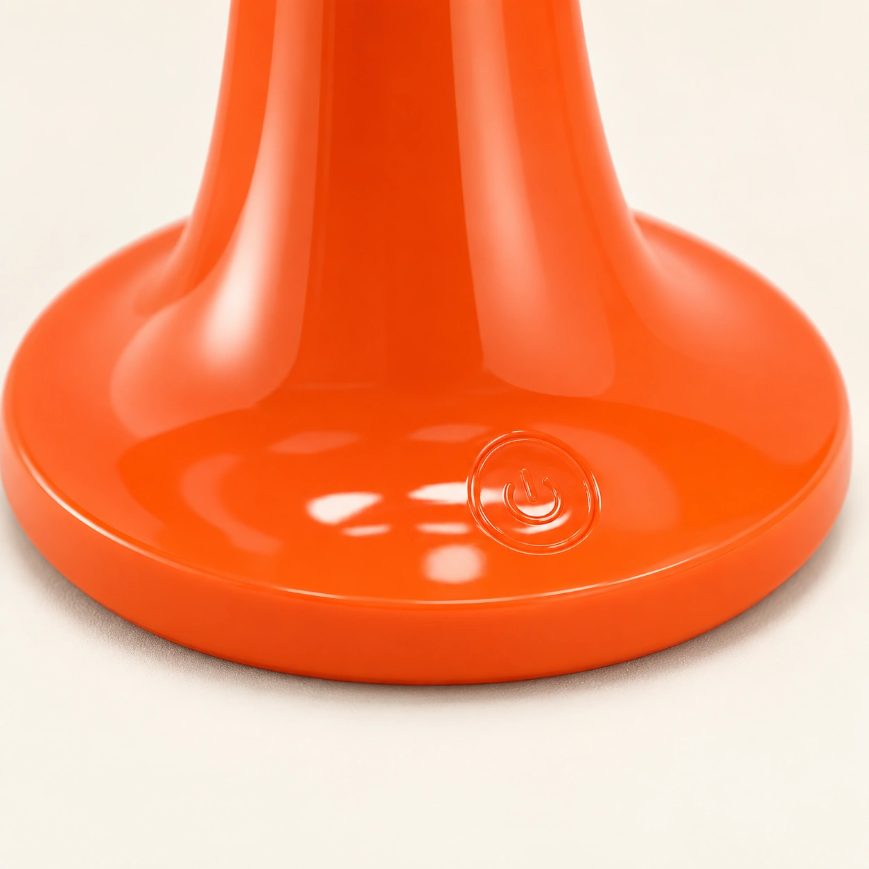Button control on the orange rechargeable mushroom lamp base