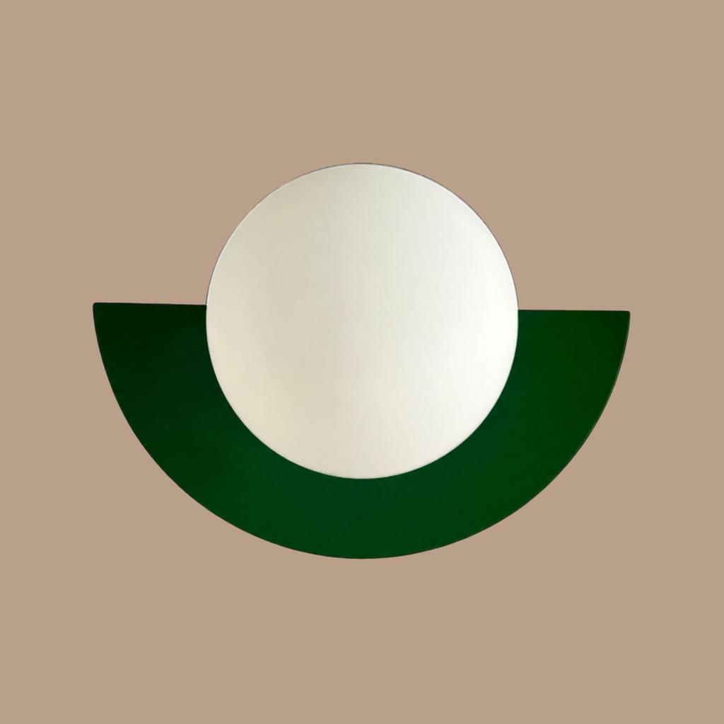 Green Macaron orb wall lamp on light brown background
