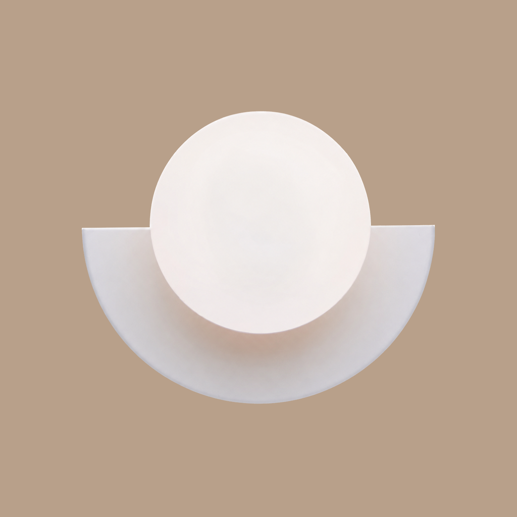 White Macaron orb wall lamp on light brown background