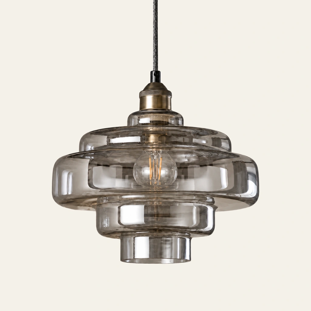 Mirelle pendant light in Smoke Grey, metal connector, on an ivory background