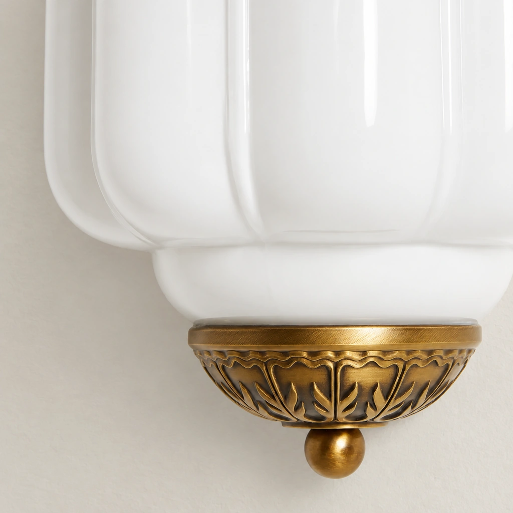 Close-up of Lumi Eloise white ribbed glass meeting the ornate lower metal cap.