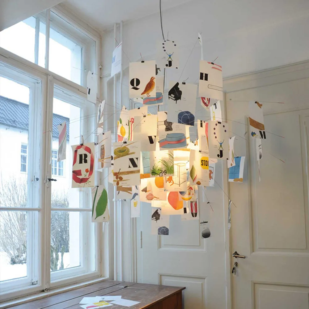Style A Zettel’z pendant light with a colorful postcard display