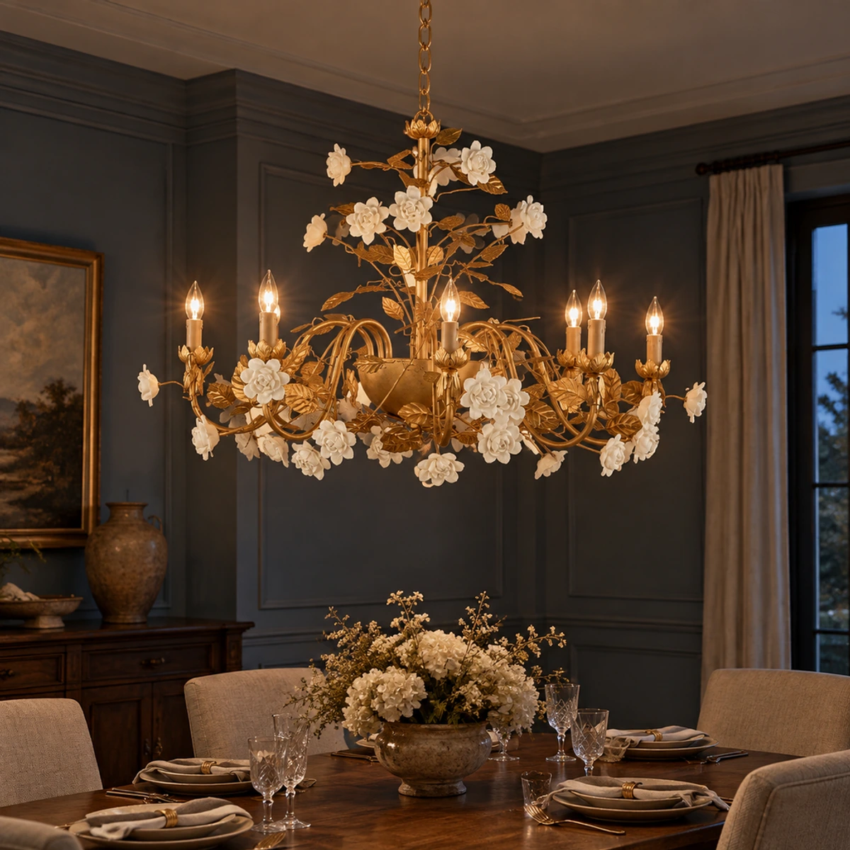 Elara floral ceramic chandelier glowing above an evening dining table
