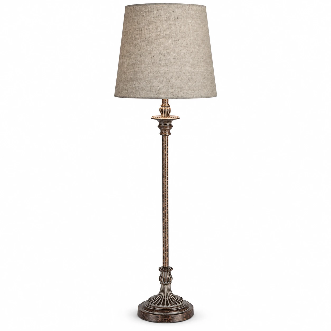 Three-quarter view of tall carved wood table lamp on white