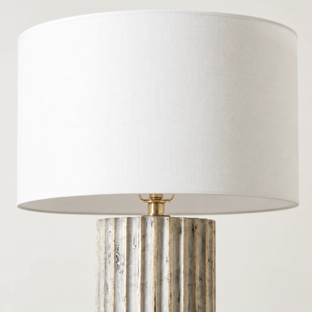 Close detail of the white drum shade and fluted base