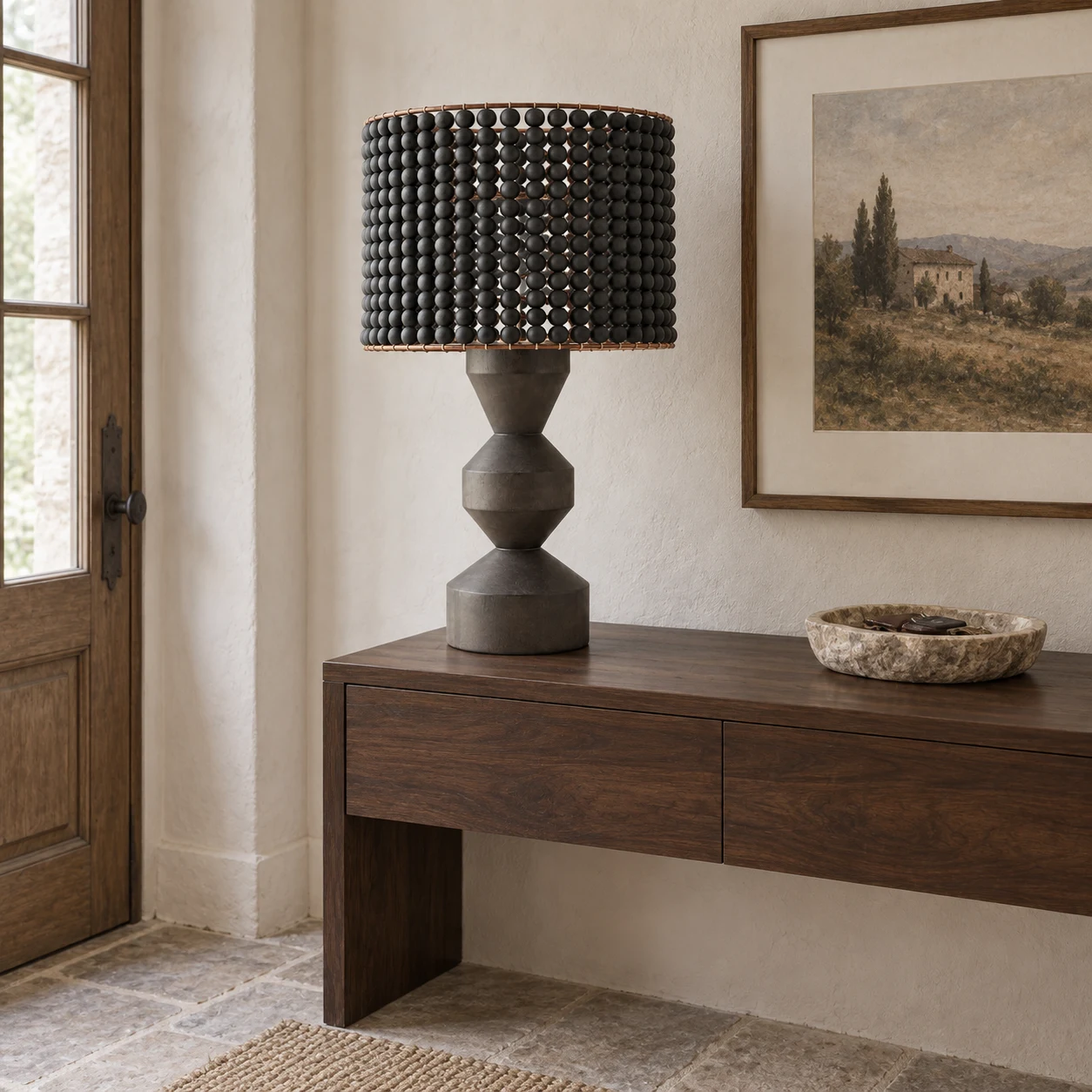Dark wood beaded table lamp on a console
