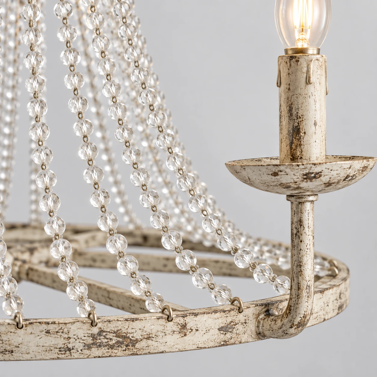Distressed off-white iron and clear crystal bead chandelier detail