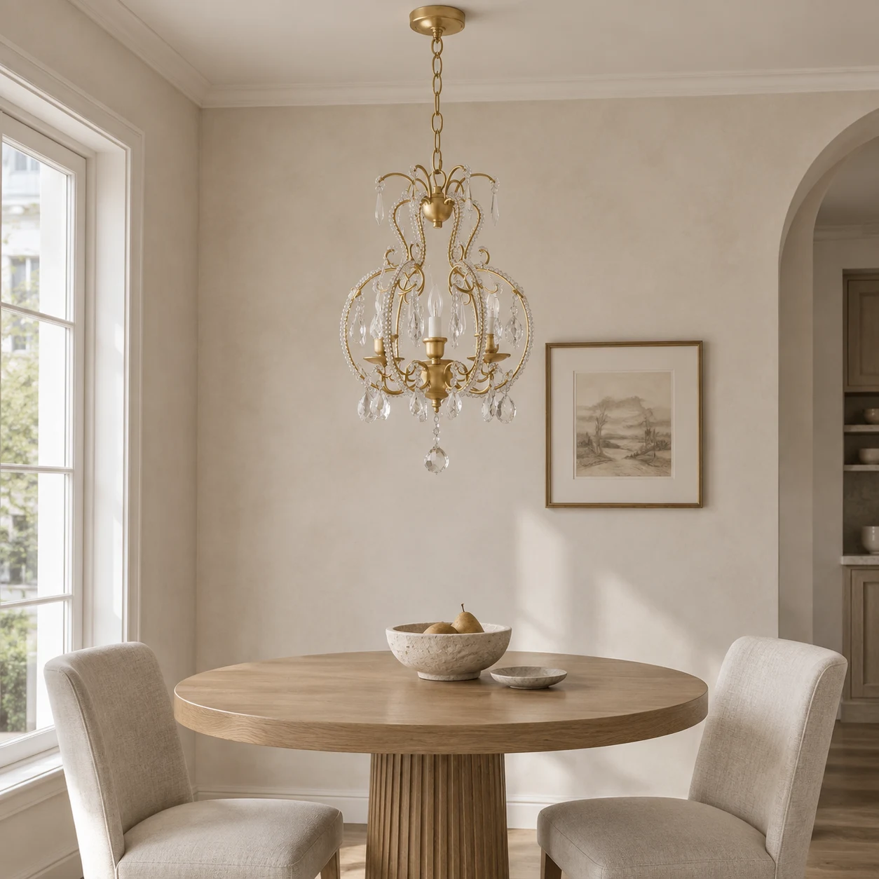 Small gold crystal chandelier over a compact dining table