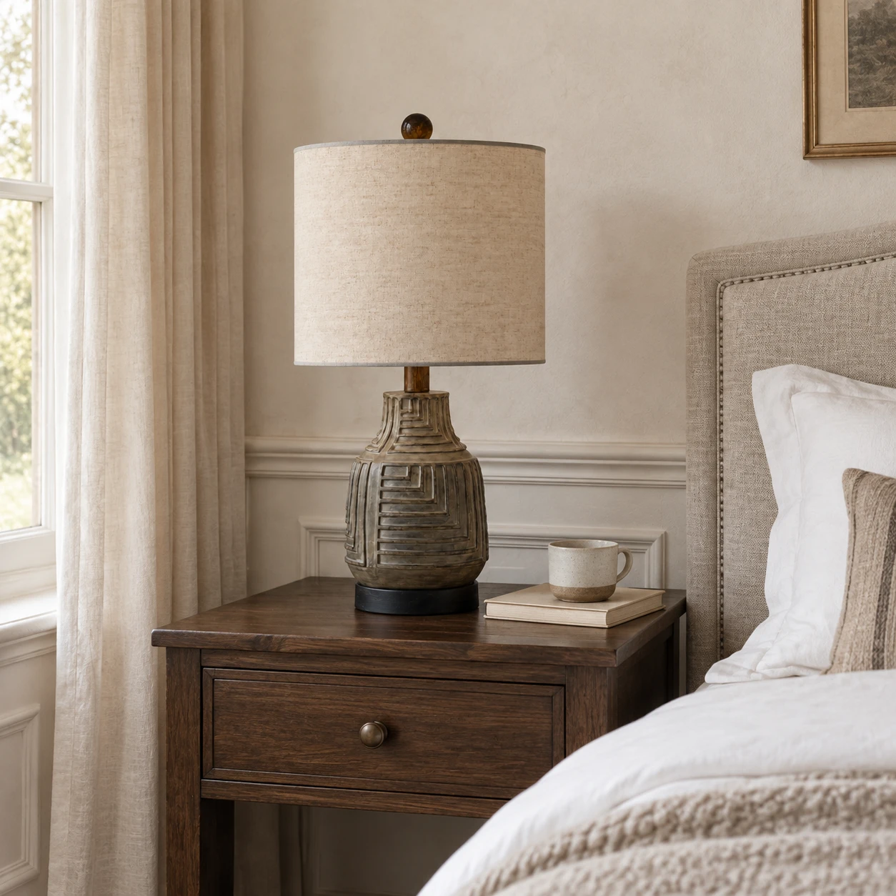 Carved wood table lamp on a boutique hotel bedside table