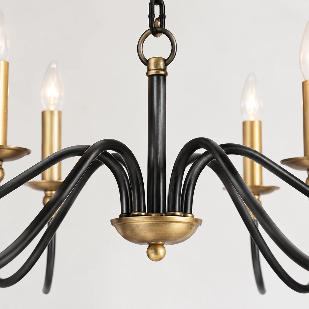 Close view of the Arden chandelier central hub and black iron arm junctions