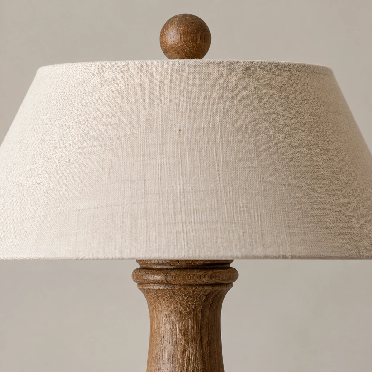 Close detail of the small top finial, shade cap and carved collar