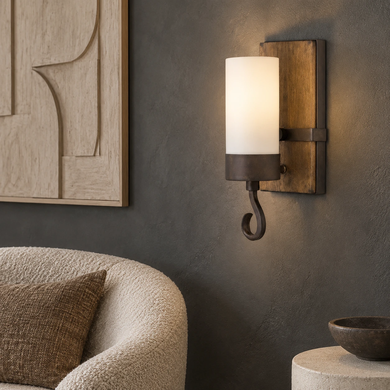 Carved wood wall sconce in a charcoal living room