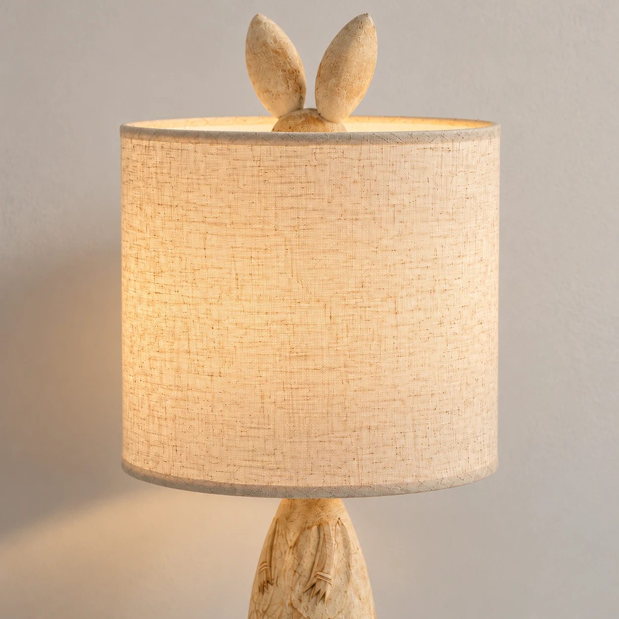 Close detail of the cylindrical fabric shade and upper fitting