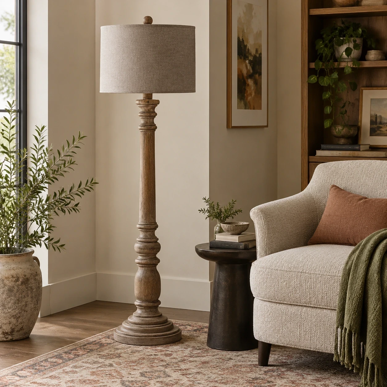 Merritt carved wood floor lamp in a hospitality reading corner
