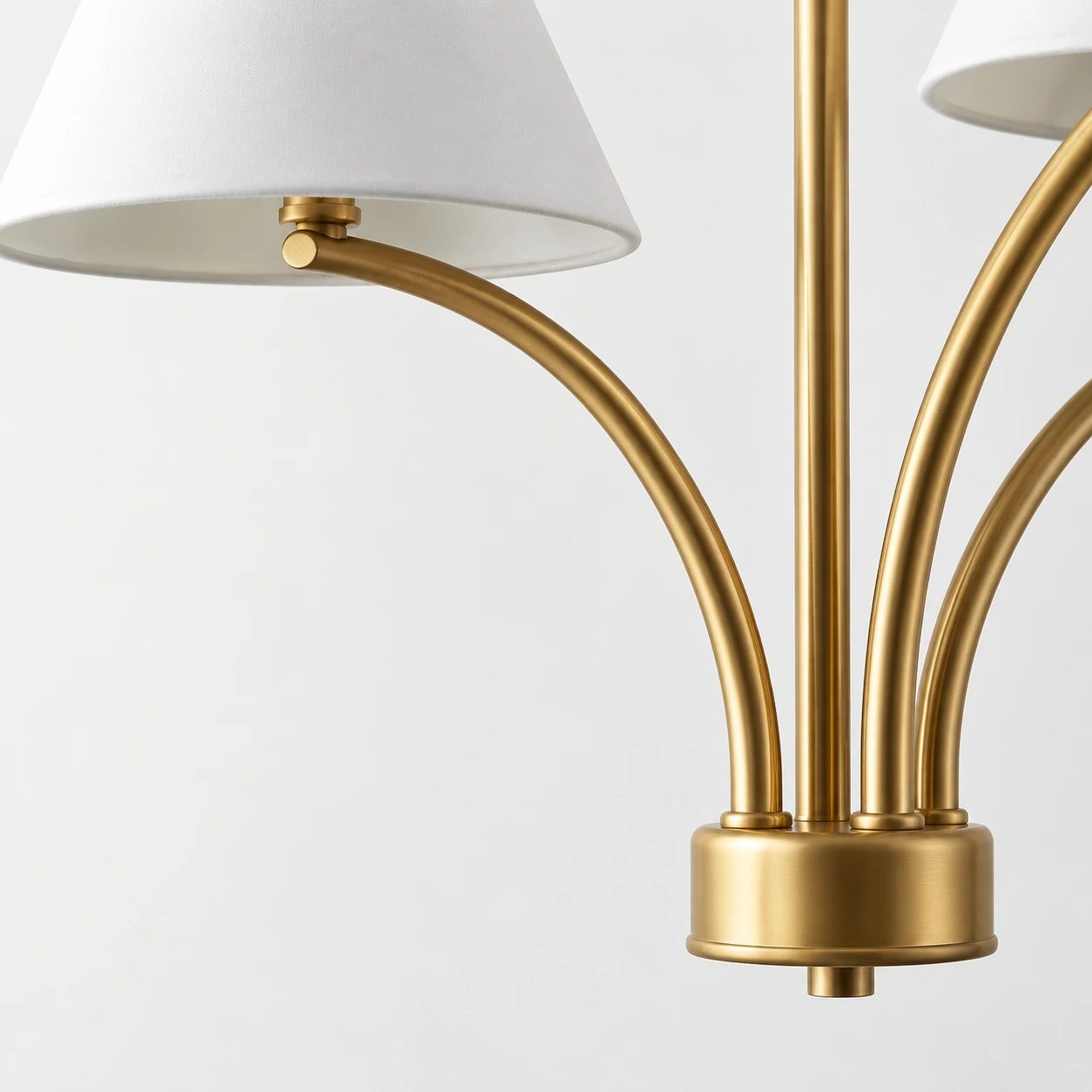 Close view of the warm brass iron arm and shade connection