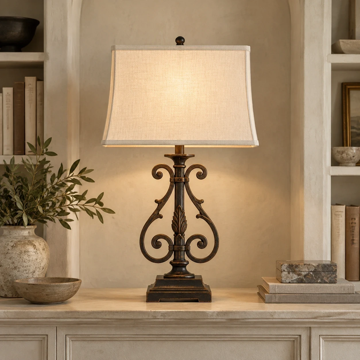 Rothbury ornate table lamp illuminated on a pale architectural console