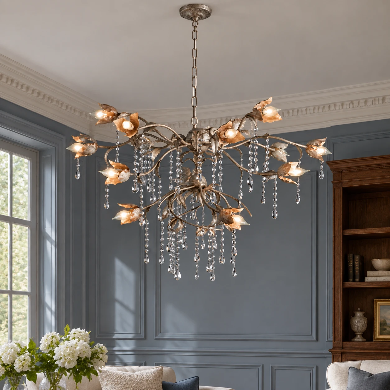 Distressed silver branching crystal chandelier in a traditional sitting room