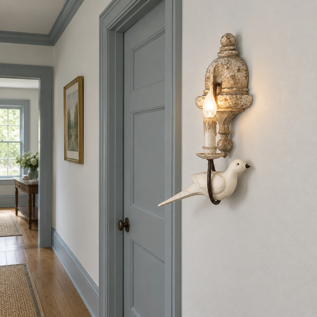Mara single-head bird wall light in a painted hallway
