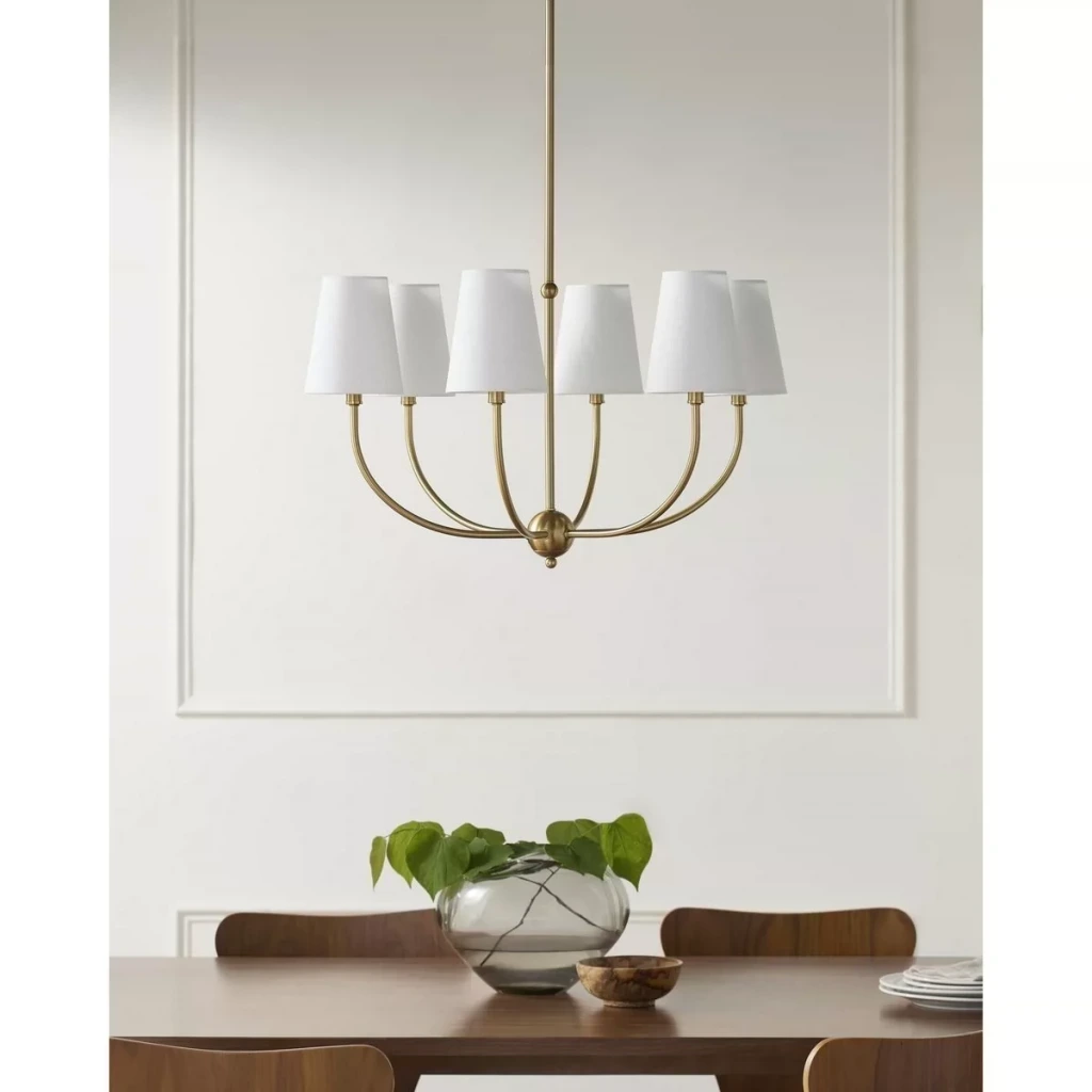 Gold six-light branch chandelier with fabric shades on a white background