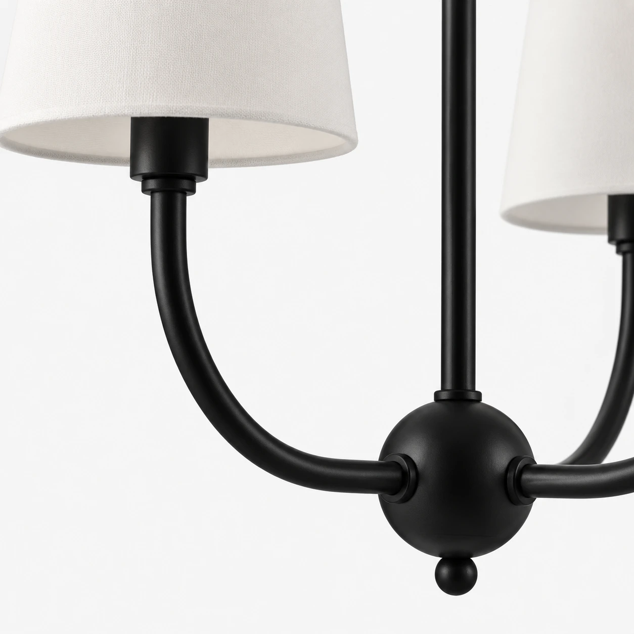 Close view of the black iron arm and shade connection