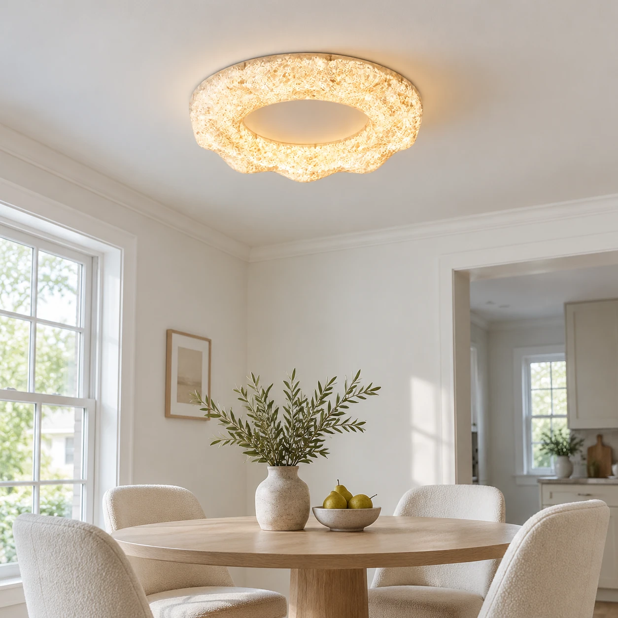 Clara sand white sculpted resin flush mount ceiling light above a dining area