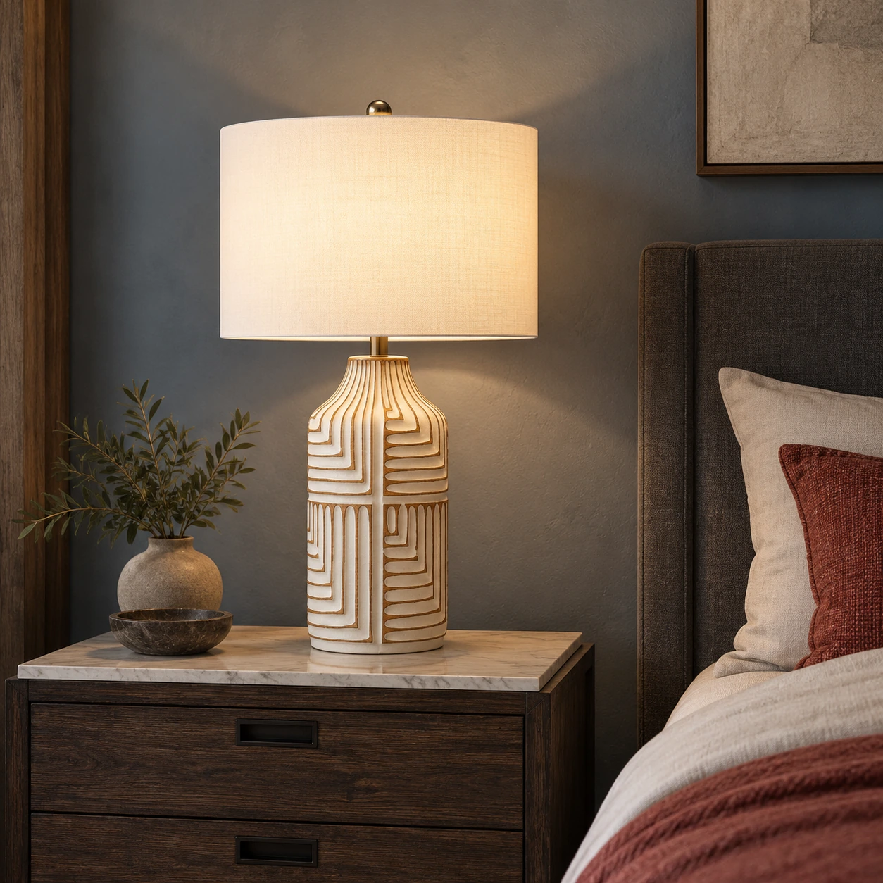 Odette carved wood table lamp on a dark reclaimed-wood nightstand in a smoke-blue bedroom