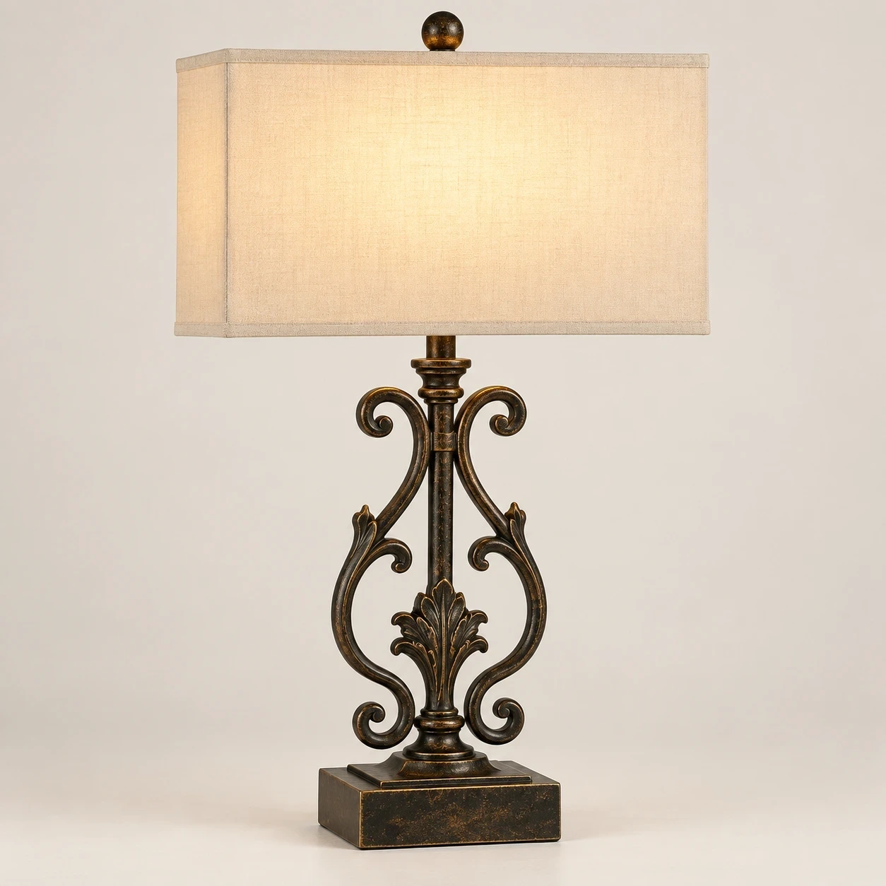 Rothbury ornate table lamp illuminated in a neutral studio
