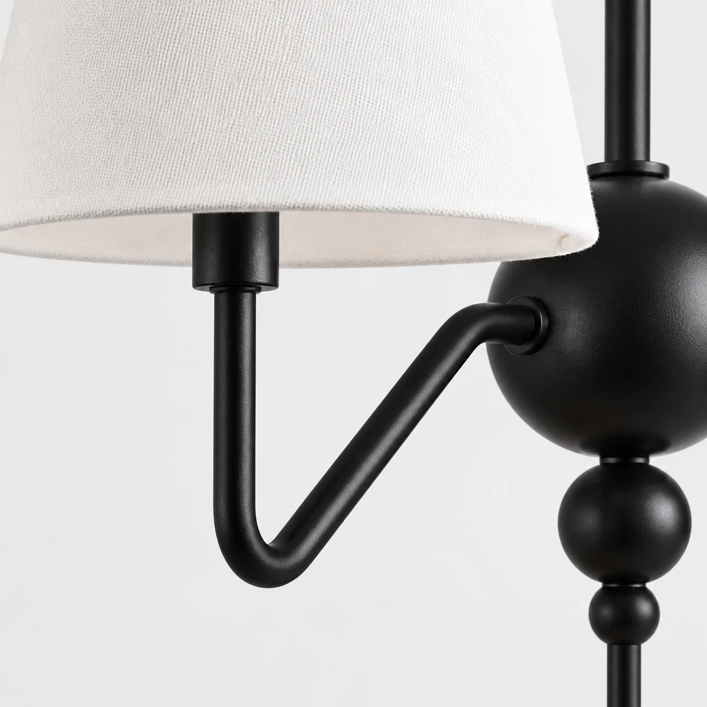 Close view of the black iron arm and shade connection