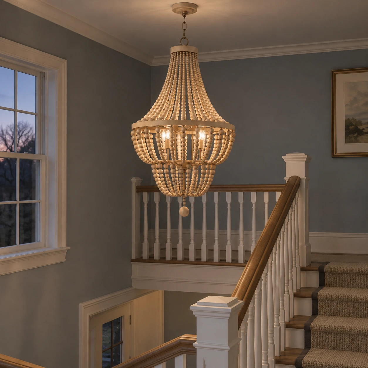Large wood-bead chandelier over a stair landing at dusk