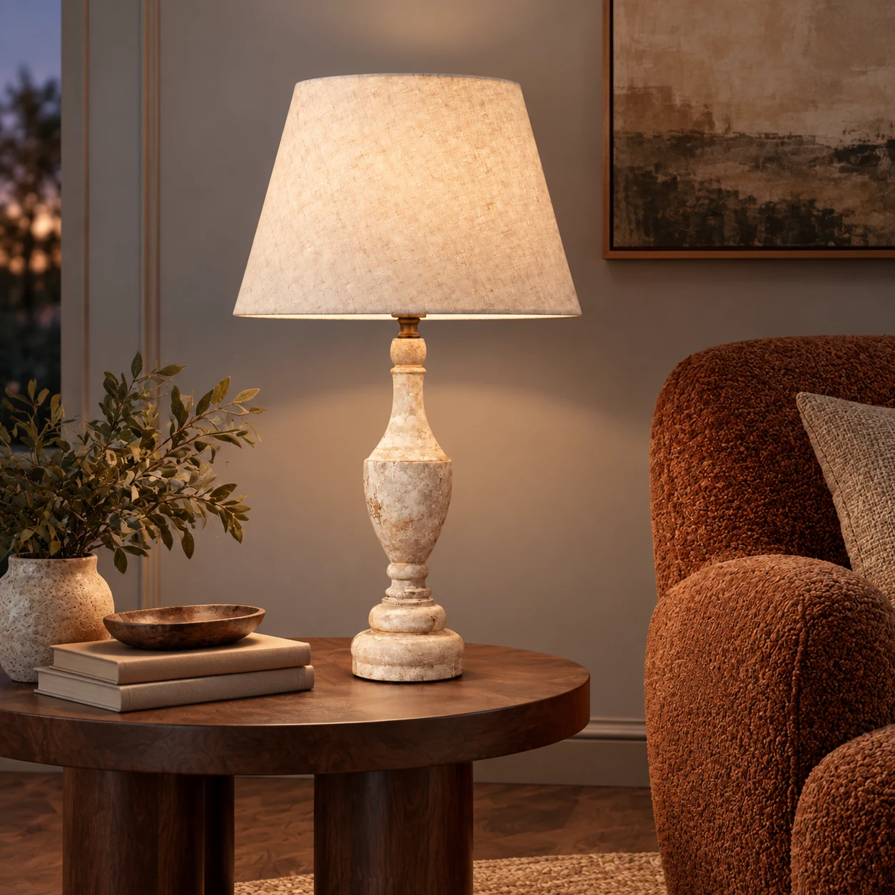 Antique white table lamp beside a lounge chair