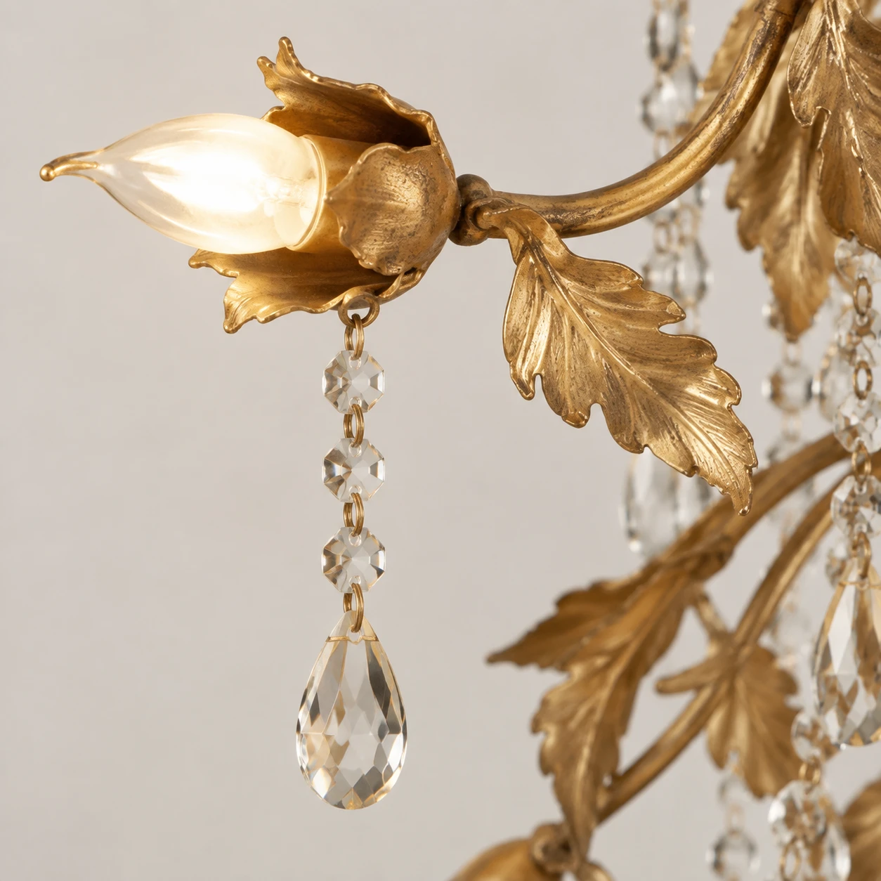 Painted iron branches and clear crystal drops detail in antique gold