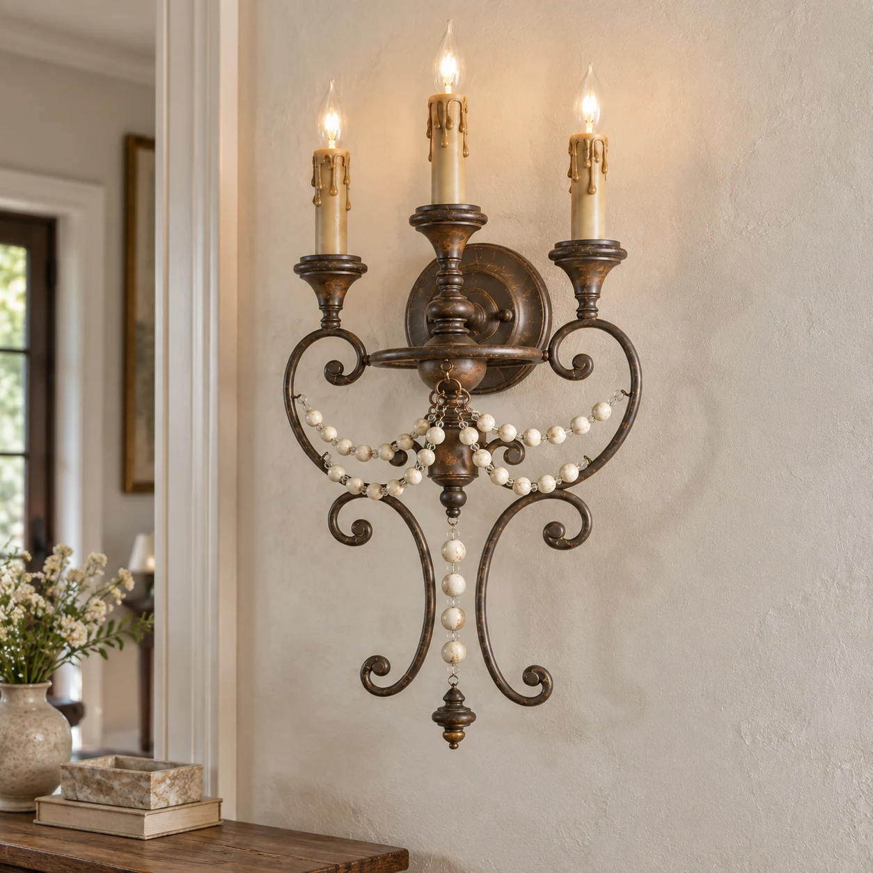 Antique three-light beaded wall sconce, residential installation scene
