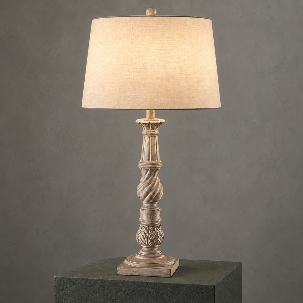 Elowen carved wood table lamp illuminated in a neutral studio