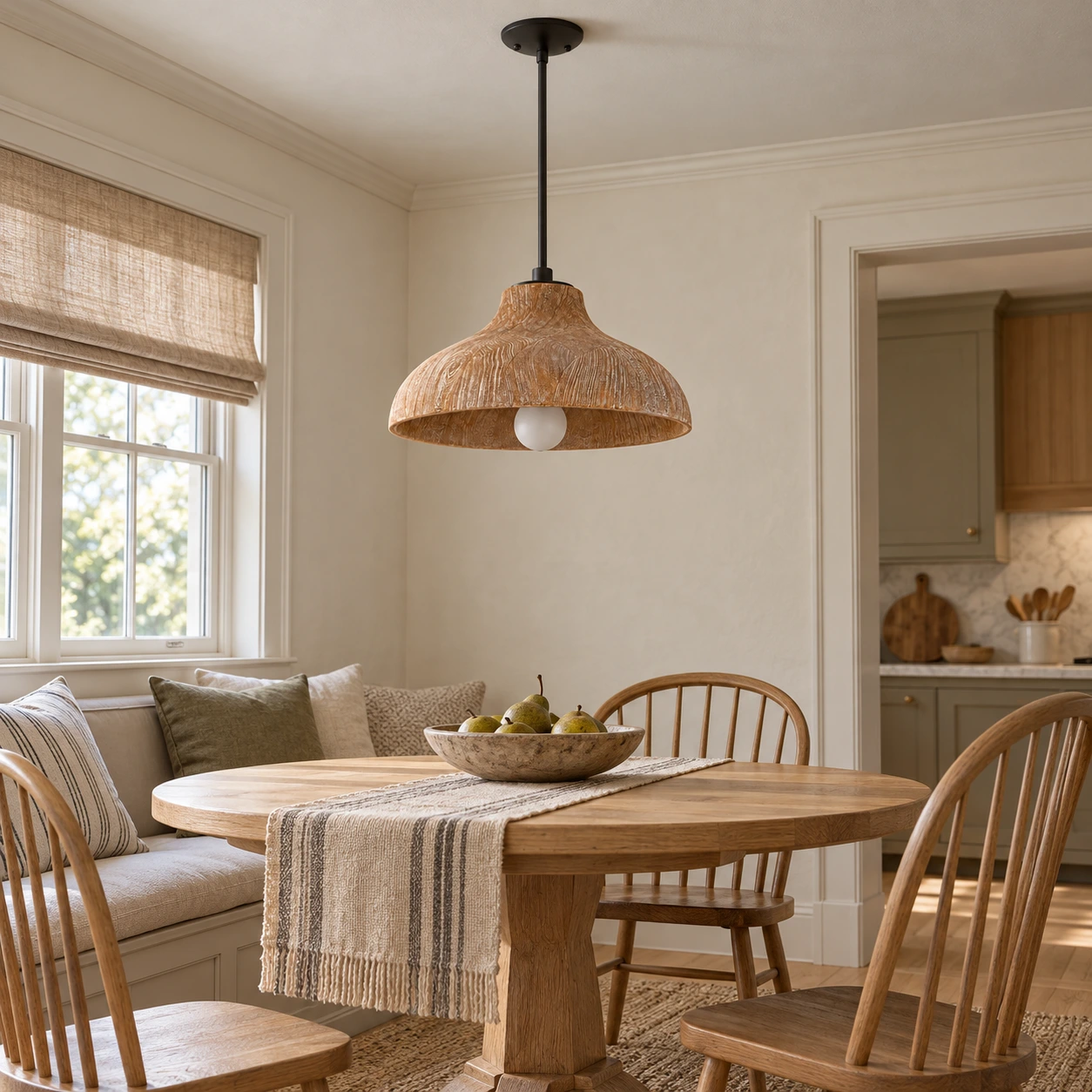 Carved wood pendant light in a breakfast nook