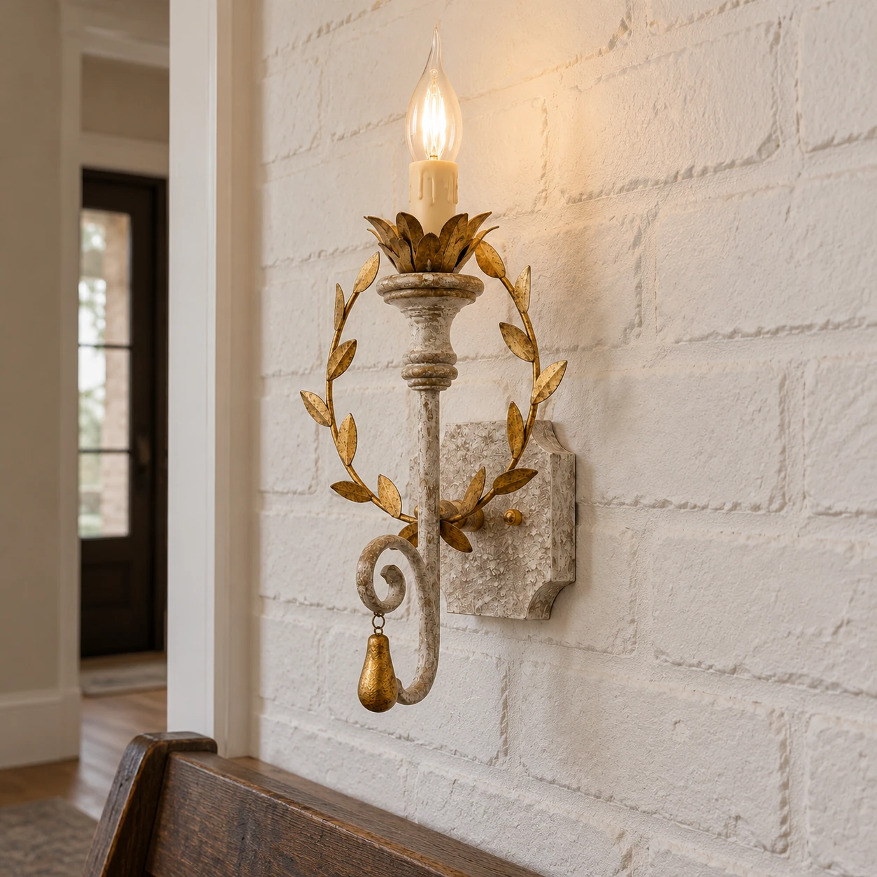Nora rustic leaf-wreath wall sconce in a farmhouse hall