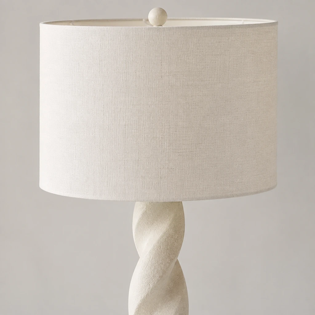 Close detail of the white cylindrical shade and upper connection