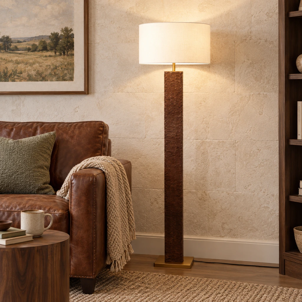 Nora floor lamp beside a leather reading chair