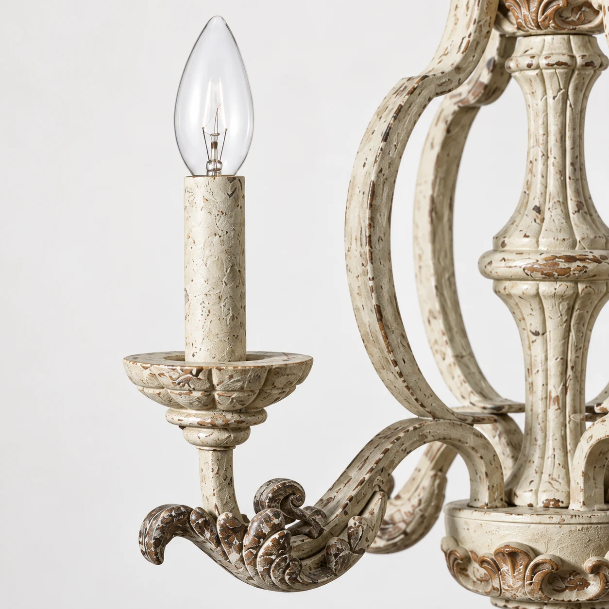 Close view of an E14 candle-style socket and clear flame bulb