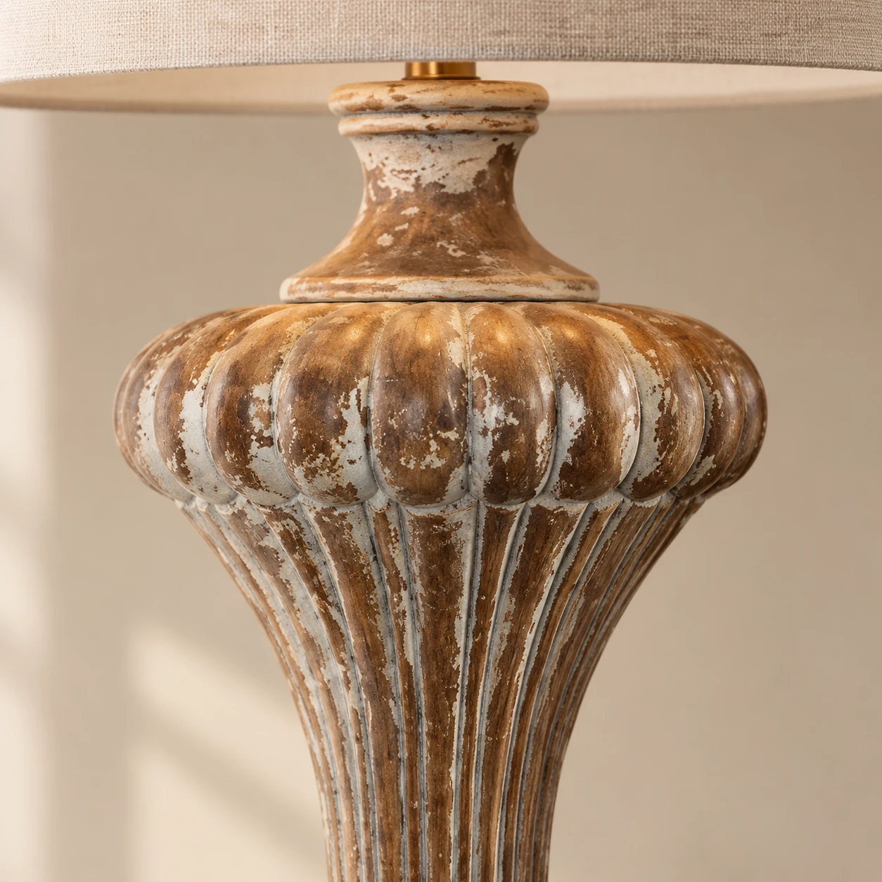 Distressed carved wood detail of the Aurelia table lamp