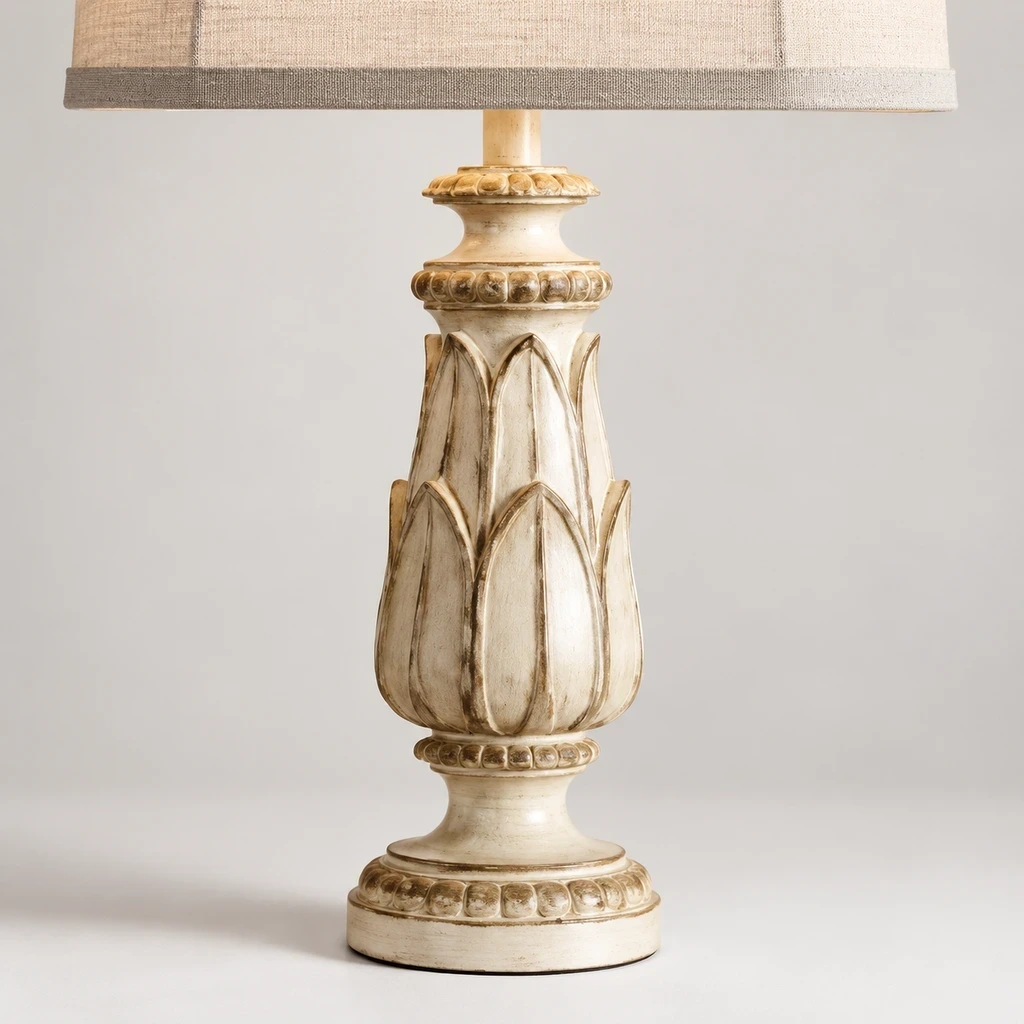 Close detail of the linen shade and carved floral base, curved ribs and natural wood