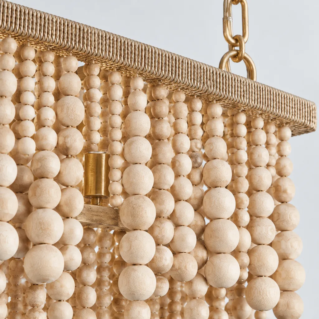 Natural wood bead chandelier detail showing candle-style socket and suspension chain