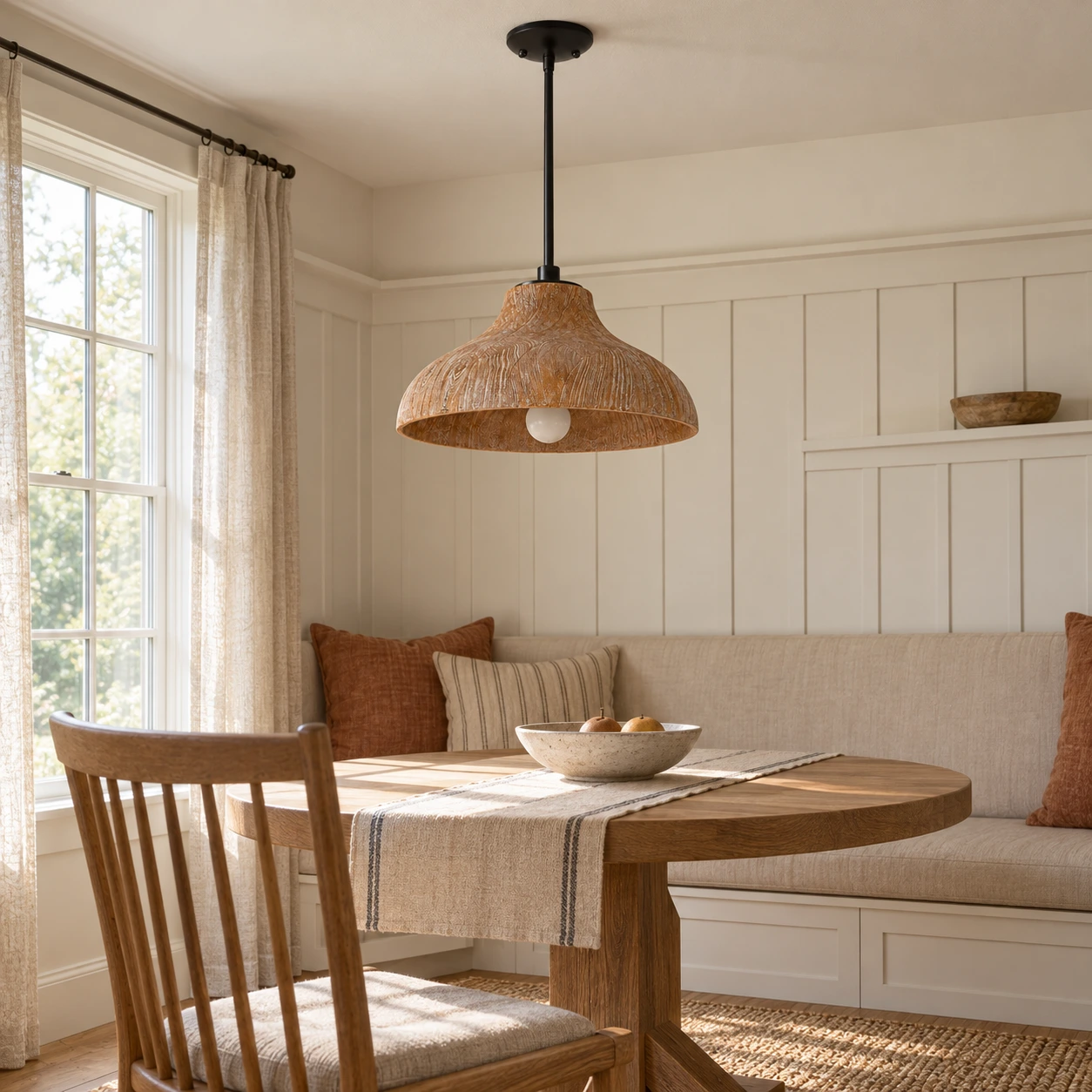 Carved wood pendant light in a breakfast area