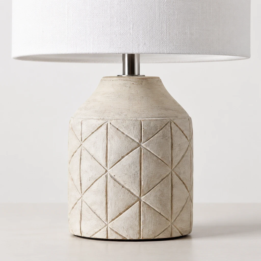 Close detail of the geometric carved wood foot resting on a tabletop