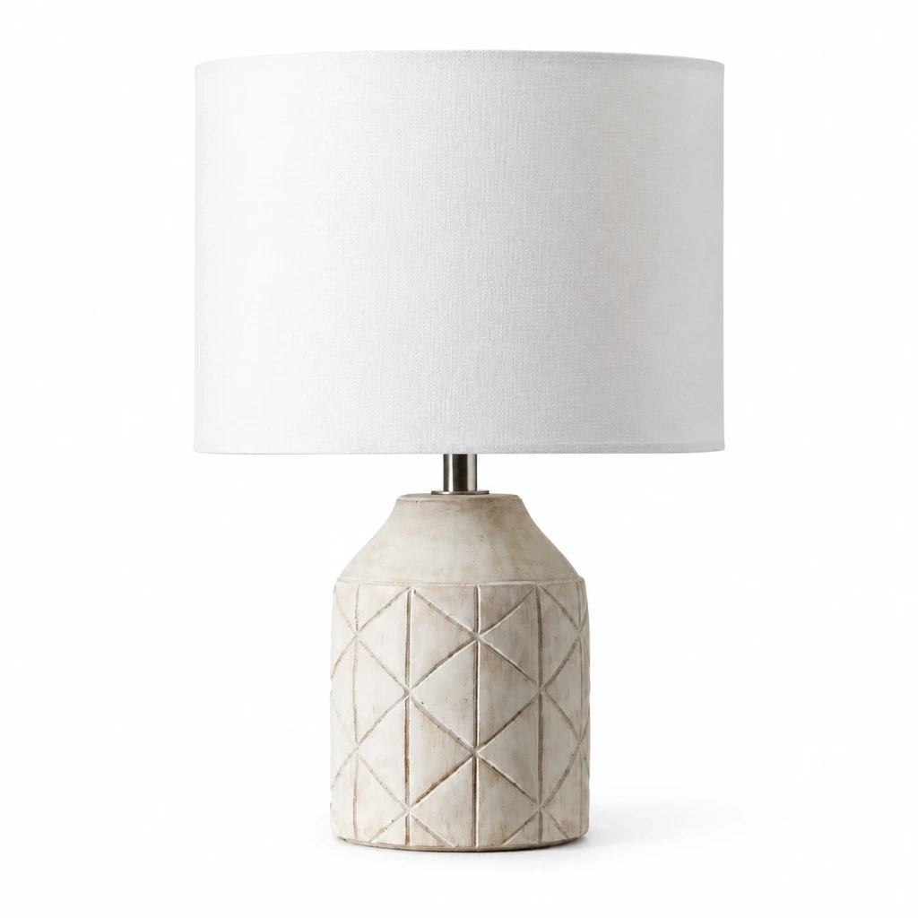Merritt Geometric Carved Wood Table Lamp with White Drum Shade on a clean white background