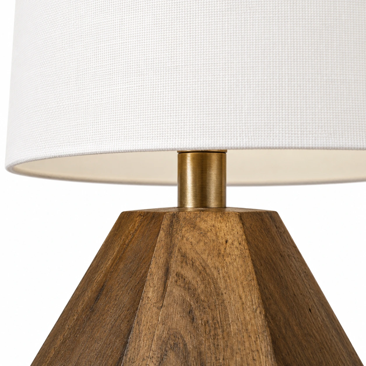 Close detail of the white fabric shade and metal connector