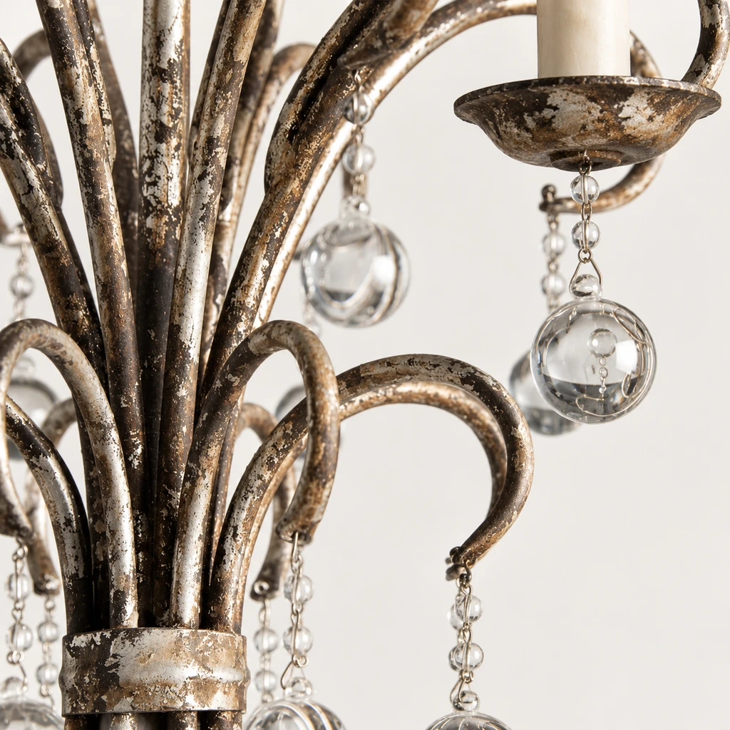 Close detail of aged iron curls and crystal drops